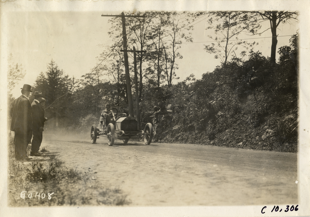 Driver in racecar, 1910 White Plains Hill Climb