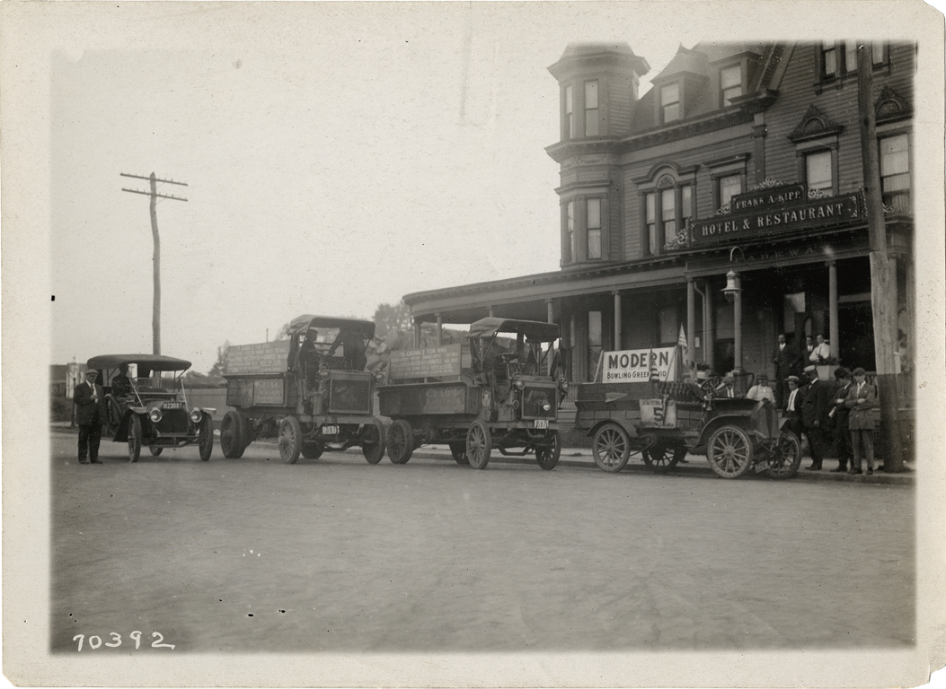 Gramm truck and automobiles in front of Frank A. Kipp hotel and restaurant