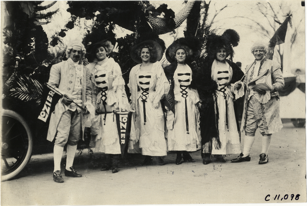 Men and women in costume with Lozier automobile, 1909 New York automobile carnival
