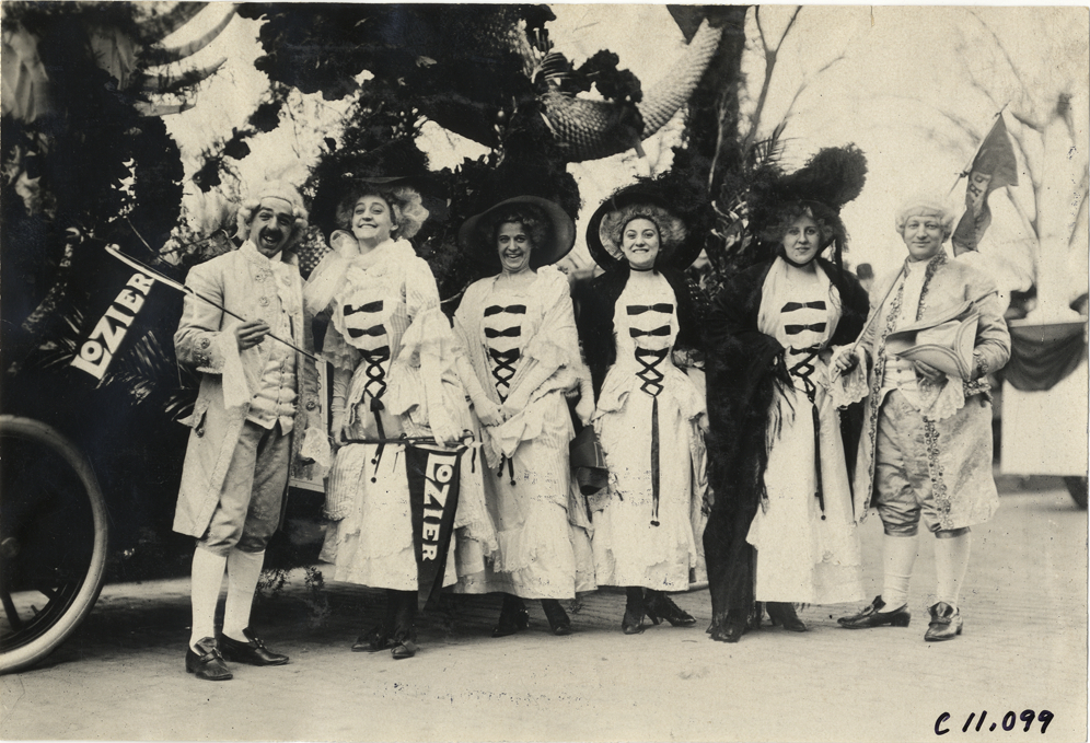 Men and women in costume with Lozier automobile, 1909 New York automobile carnival