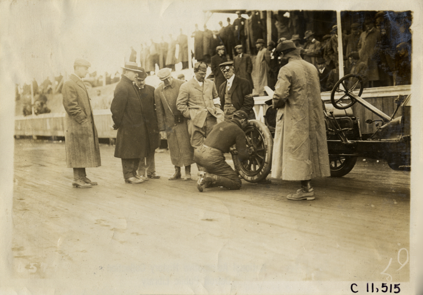 Racecar driver changing tire, Atlanta Speedway