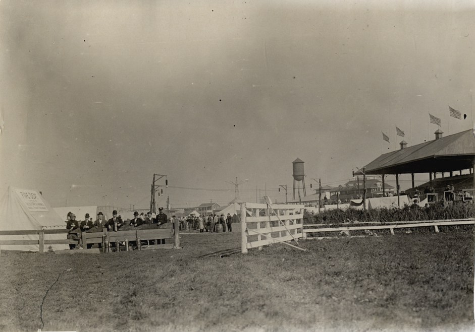 Men standing in front of Fire Dept. tent, 1908 Brighton Beach races