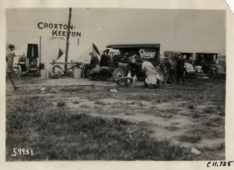 Men working on Croxton-Keeton racecar, 1909 Brighton Beach races