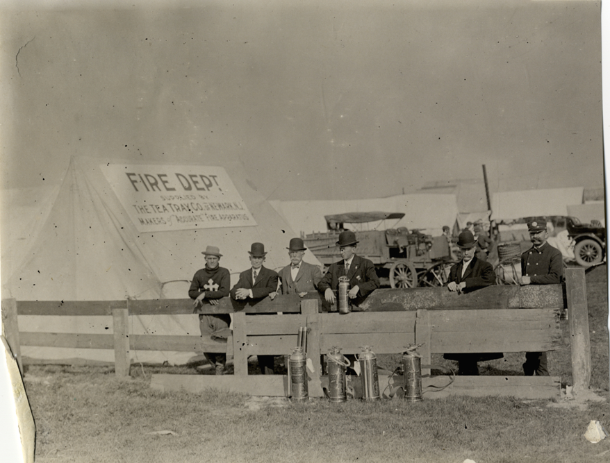 Men standing in front of Fire Dept. tent, 1908 Brighton Beach races