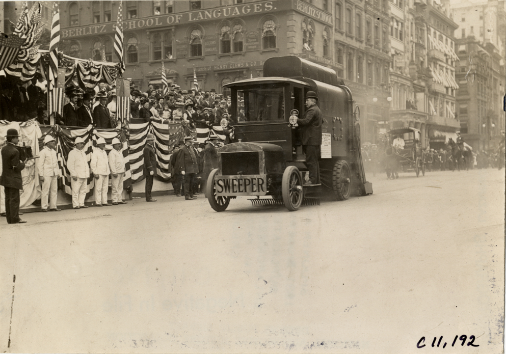 Man riding street sweeper, 1909 New York street cleaners parade