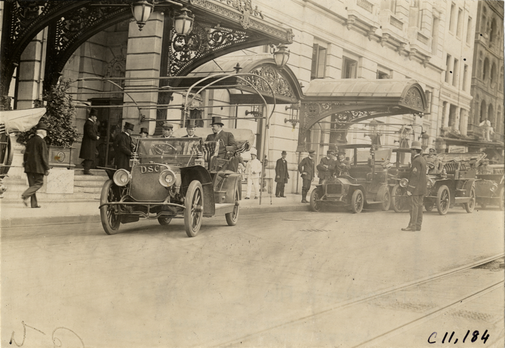 Officials in automobile, 1909 New York street cleaners parade