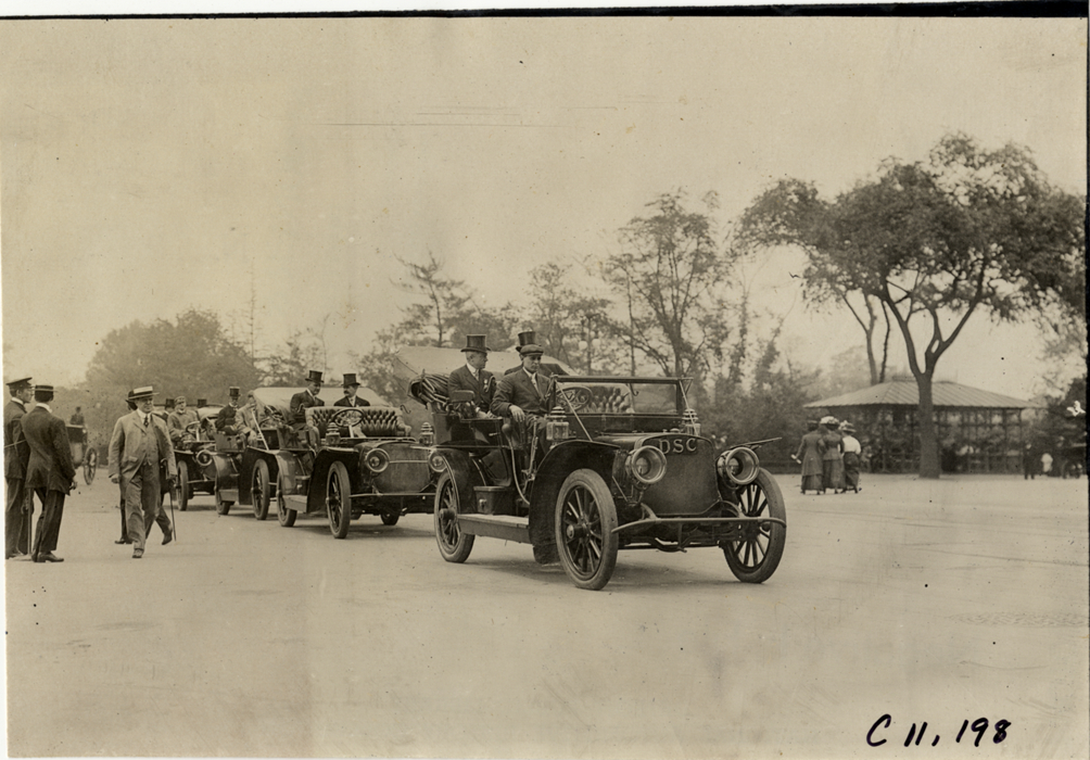 Officials in automobiles, 1909 New York street cleaners parade