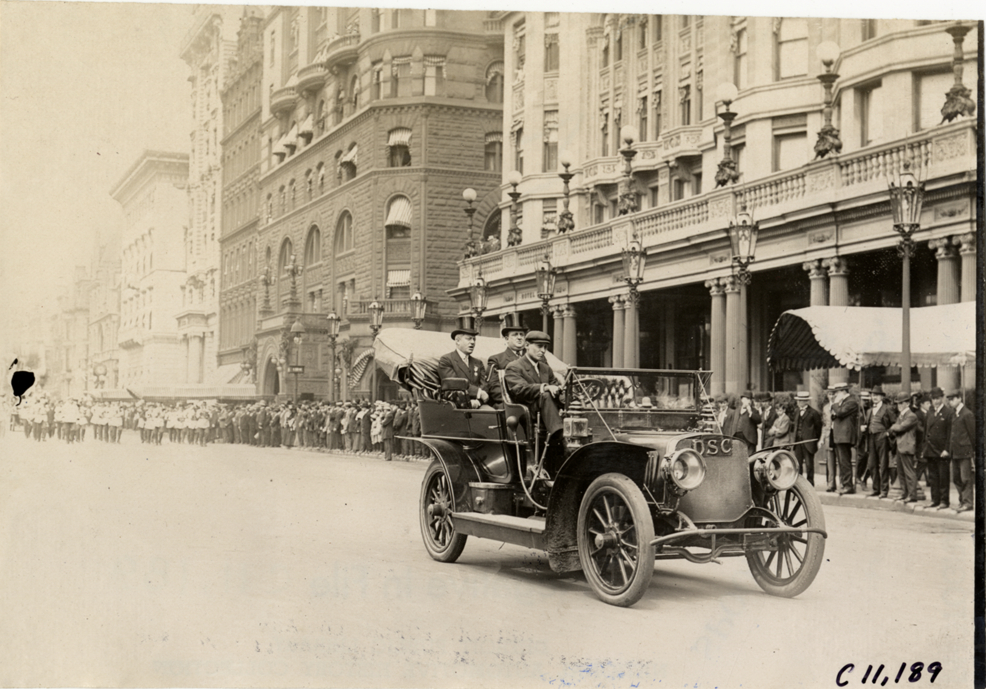 Officials in automobile, 1909 New York street cleaners parade