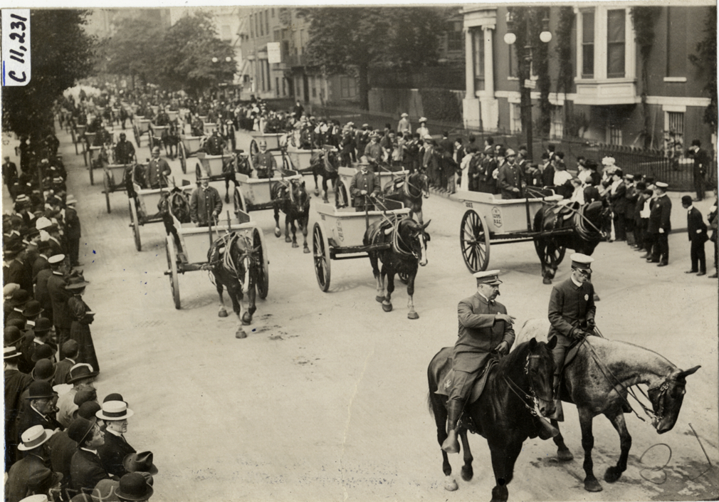 Street cleaners driving horse-drawn carts, 1909 New York street cleaners parade