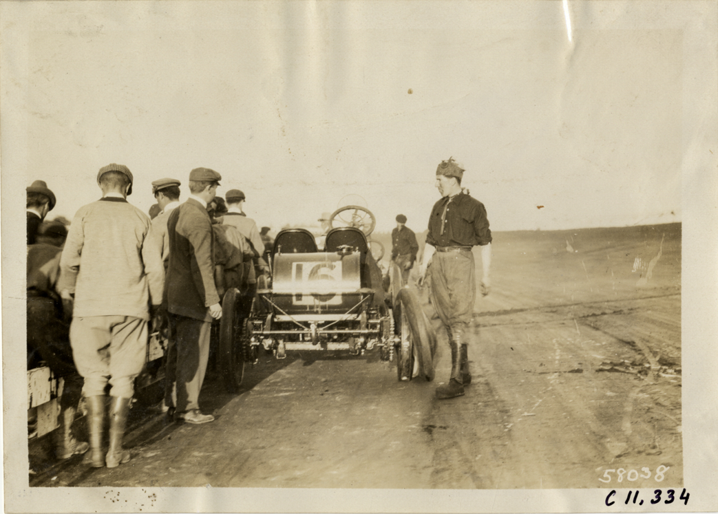 Driver changing tire on racecar, Atlanta Speedway