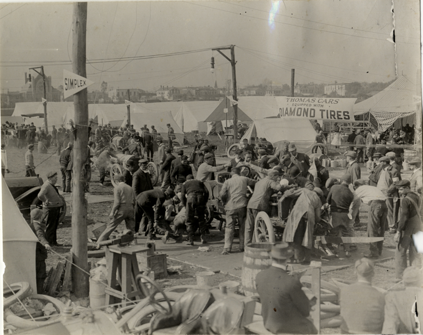 Men working on racecar, 1908 Brighton Beach races