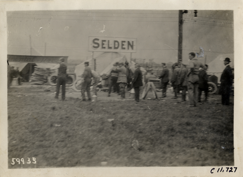 Men working on Selden racecar, 1909 Brighton Beach races
