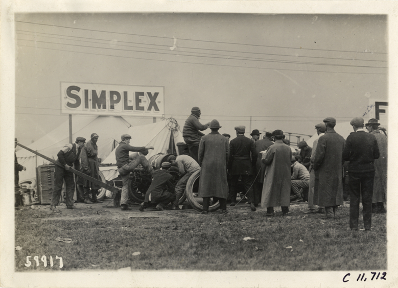 Men working on Simplex racecar, 1909 Brighton Beach races