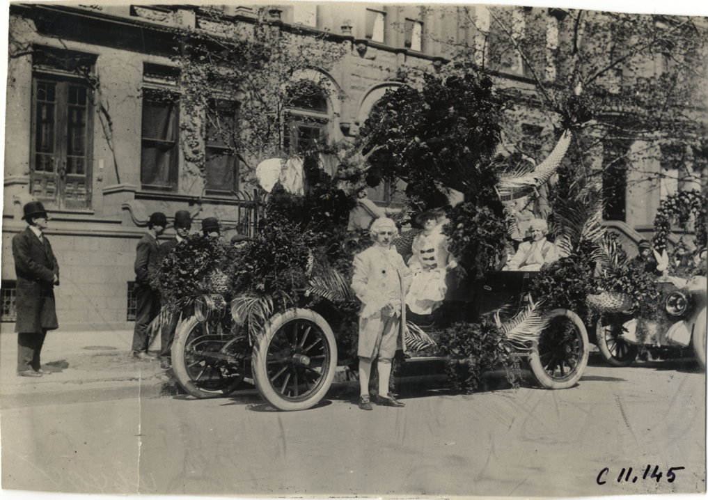 Costumed motorists with Lozier automobile, 1909 New York automobile carnival