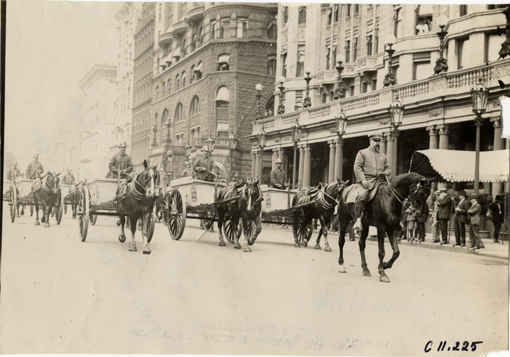 Street cleaners driving horse-drawn carts, 1909 New York street cleaners parade