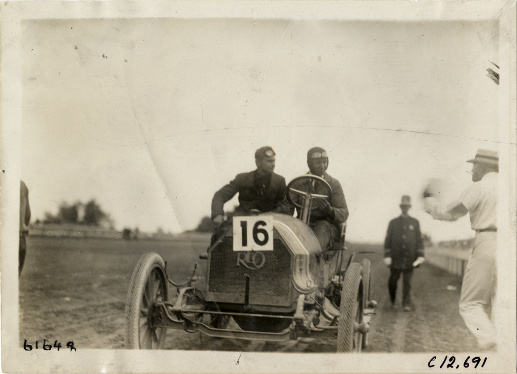 Driver and passenger in Reo racecar, 1910 Empire City races