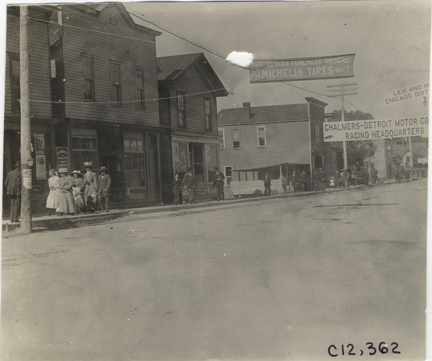 Banners displayed over street, 1909 Crown Point races