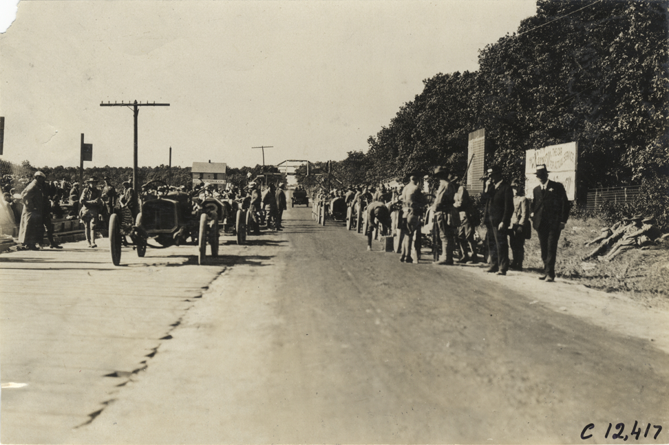 Racecars lined up in road, 1909 Crown Point races