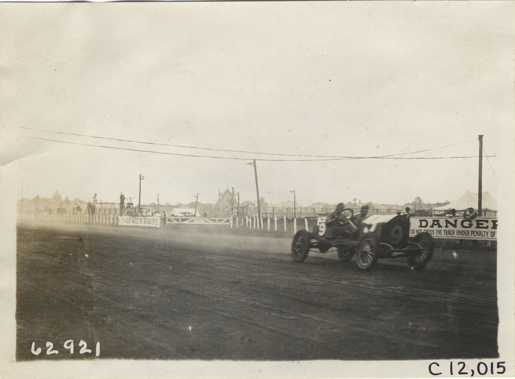 Driver and passenger in racecar, 1910 Brighton Beach races