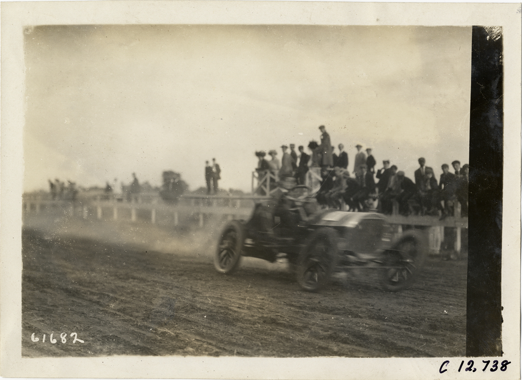 Driver in racecar, 1910 Empire City races