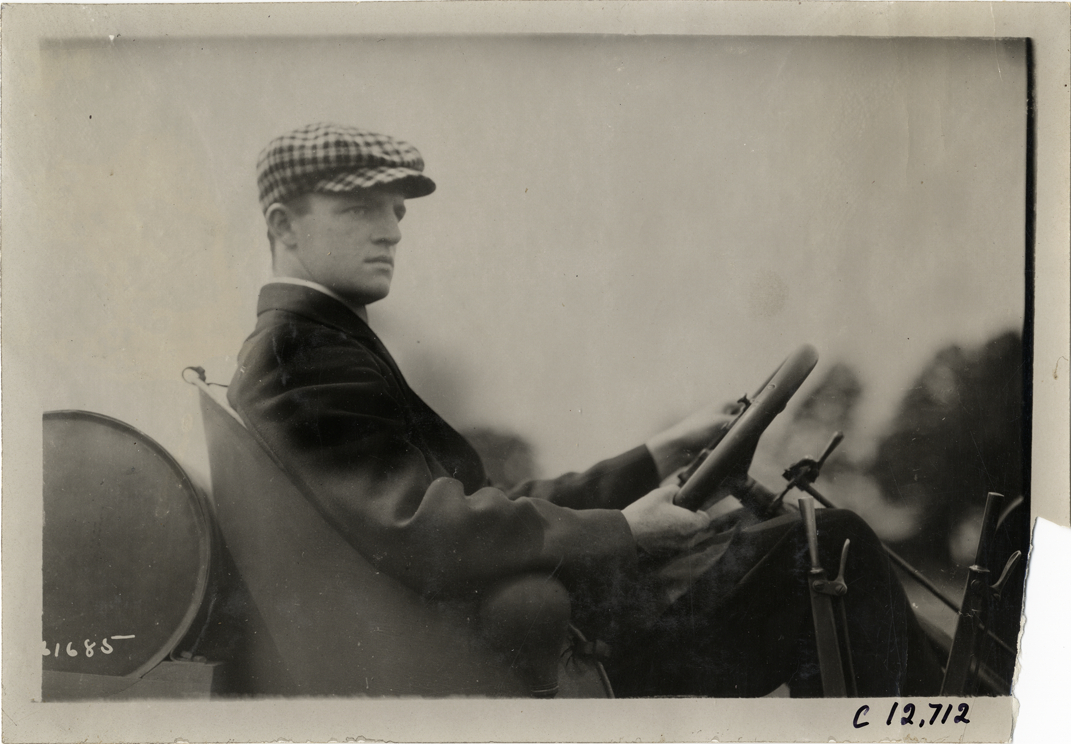 Driver in racecar, 1910 Empire City races