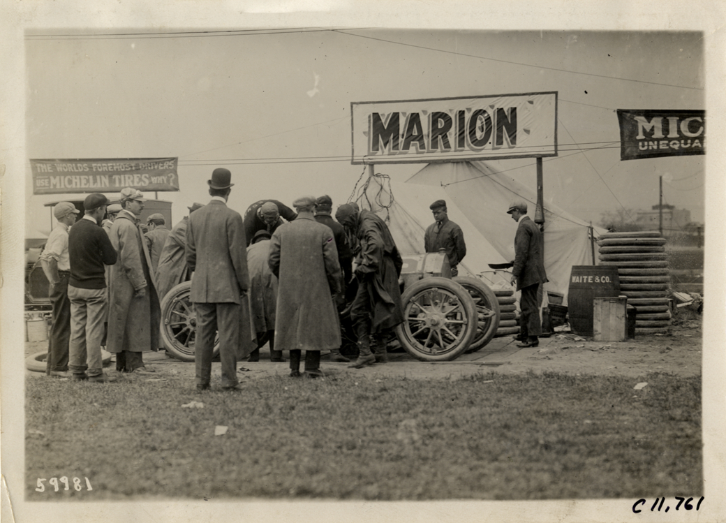 Men working on Marion racecar, 1909 Brighton Beach races