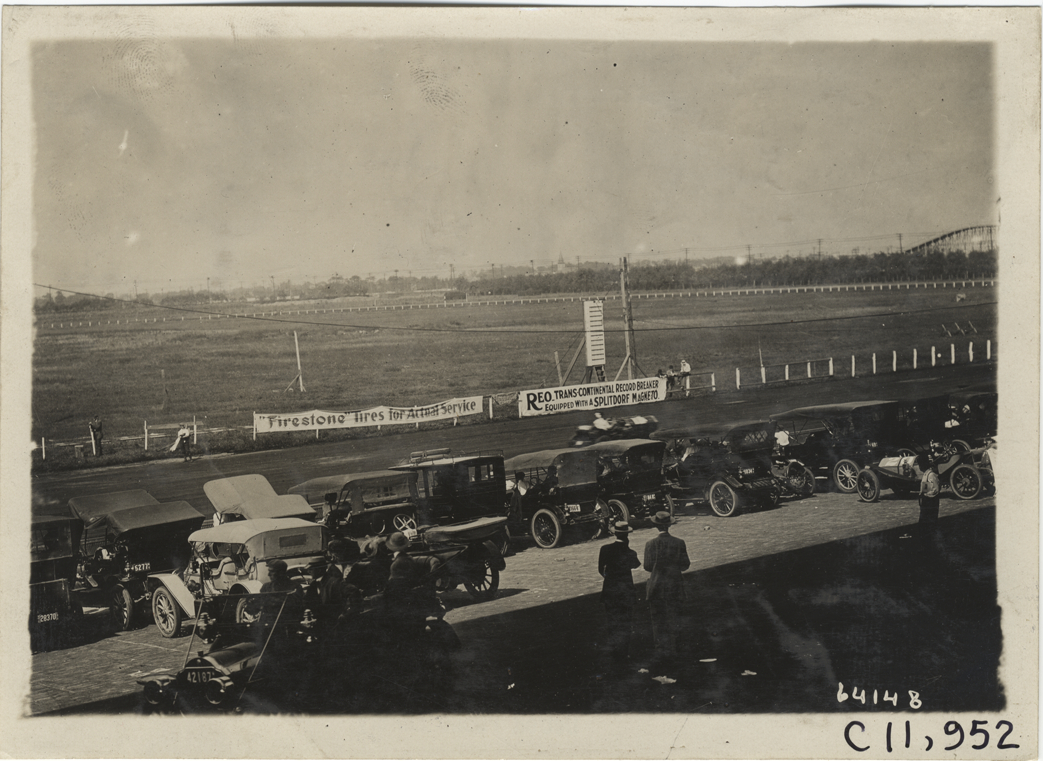 Automobiles parked along racetrack, 1910 Brighton Beach races