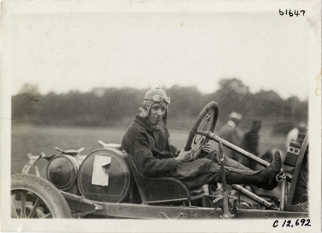 Driver in racecar, 1910 Empire City races