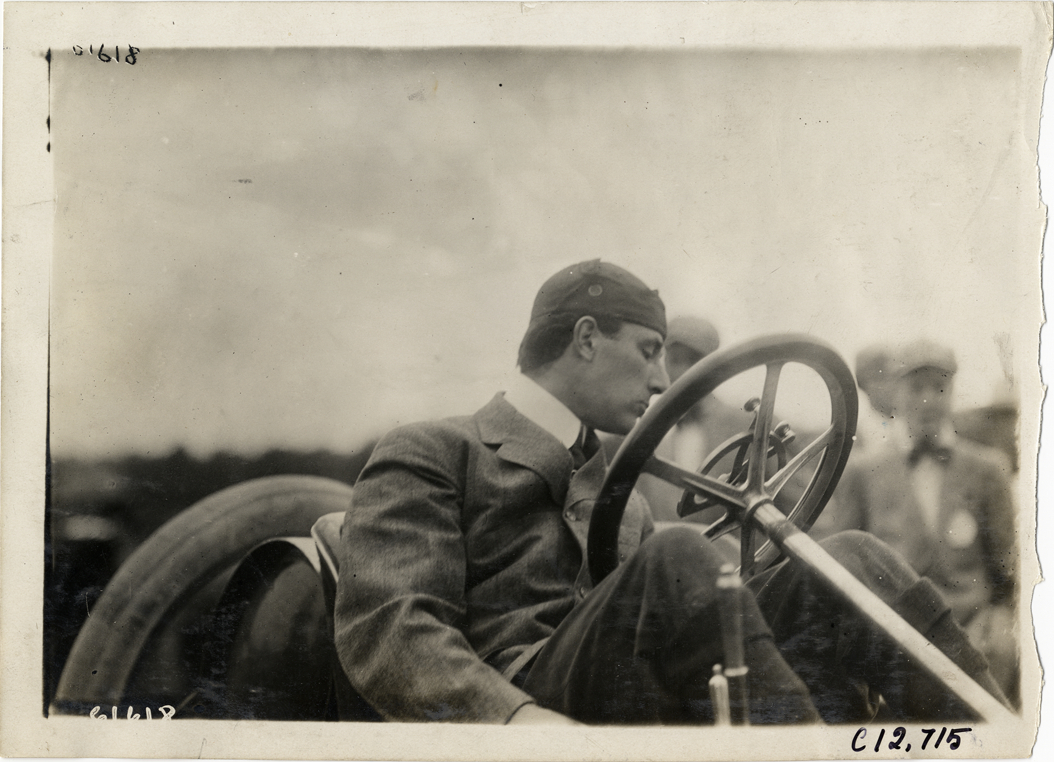 Driver in racecar, 1910 Empire City races