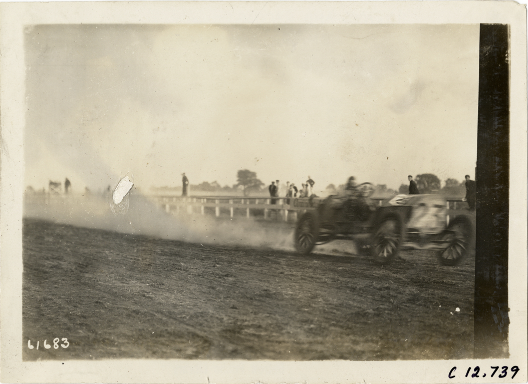Driver in racecar, 1910 Empire City races