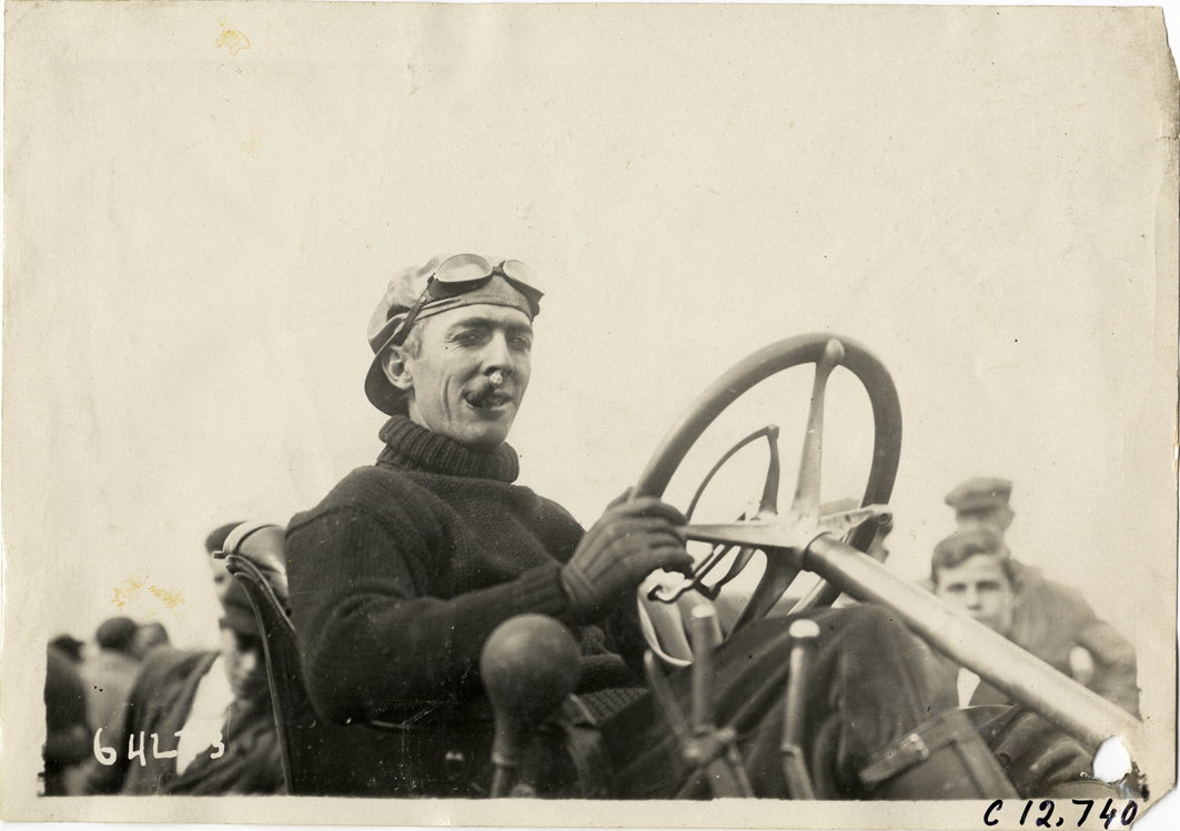 Driver in racecar, 1910 Empire City races