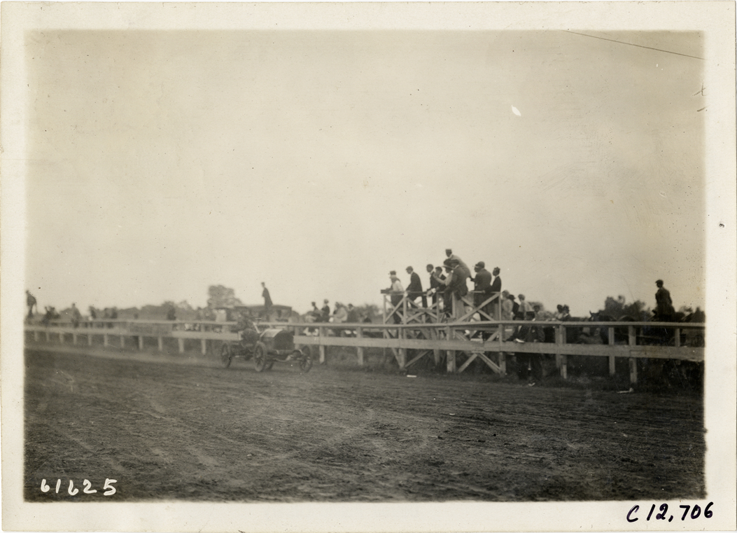 Driver in racecar, 1910 Empire City races
