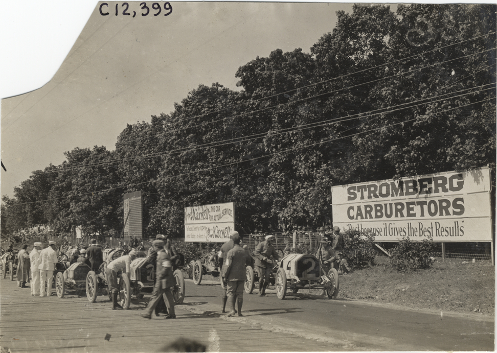 Racecars lined up on road, 1909 Crown Point races