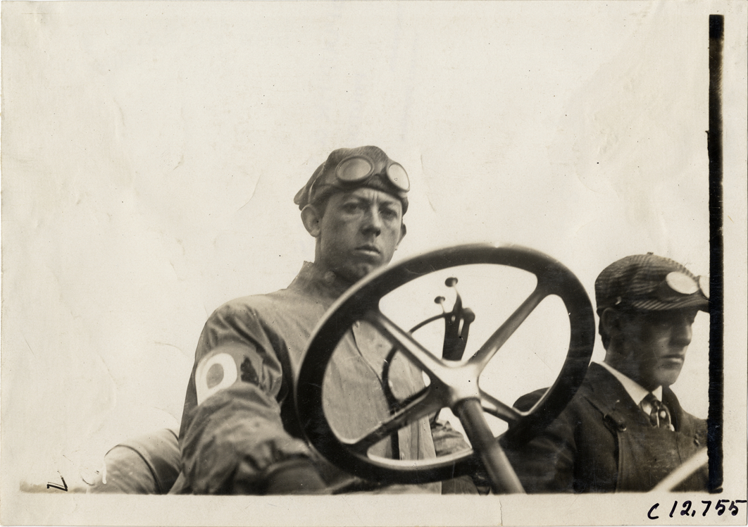 Driver in racecar, 1910 Empire City races
