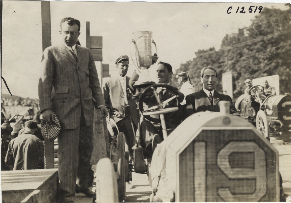 Joe Matson holding Cobe Trophy, 1909 Crown Point races