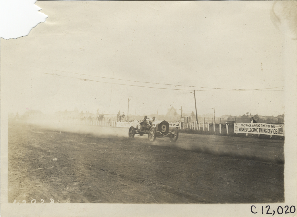 Driver and passenger in racecar, 1910 Brighton Beach races