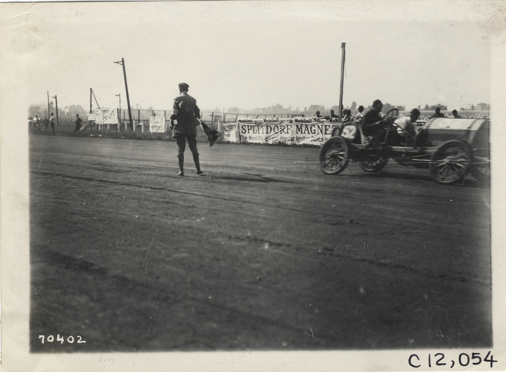 Racecar crossing finish line, 1911 Brighton Beach races