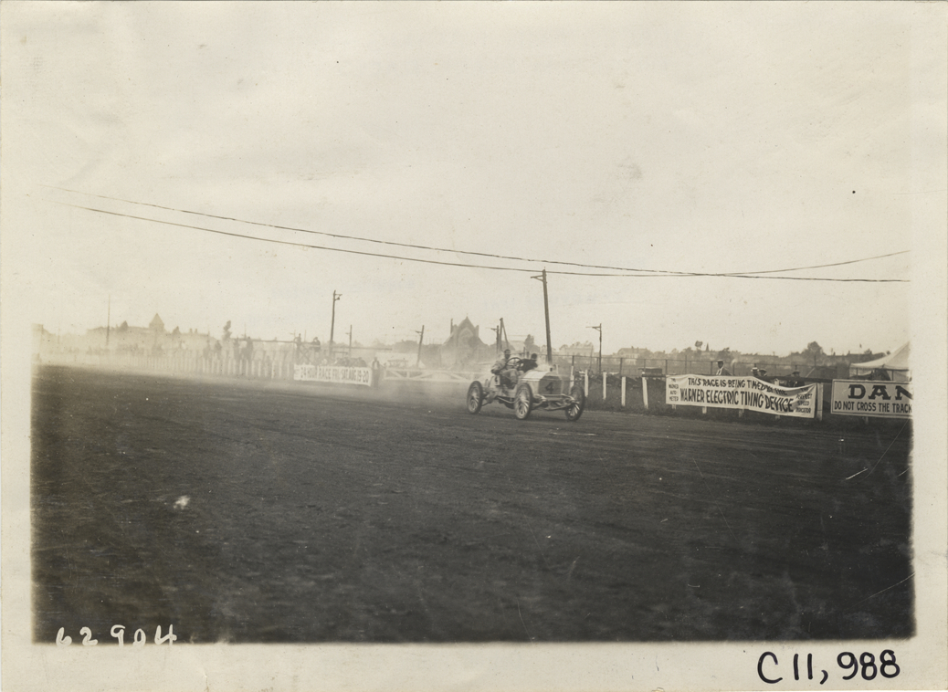 Driver and passenger in racecar, 1910 Brighton Beach races