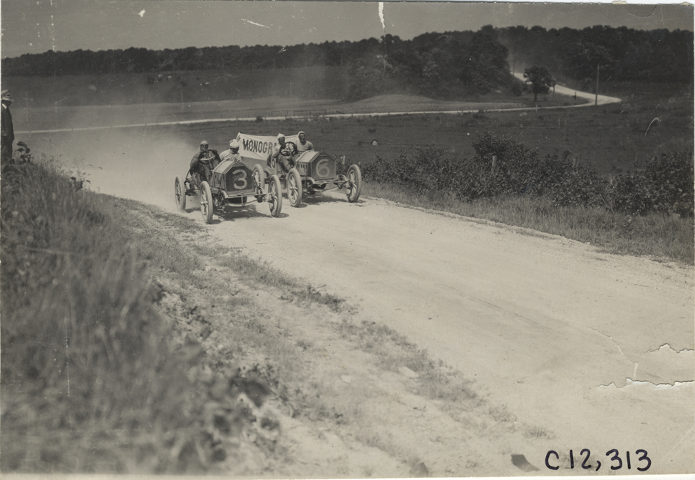 Two racecars on road, 1909 Crown Point races