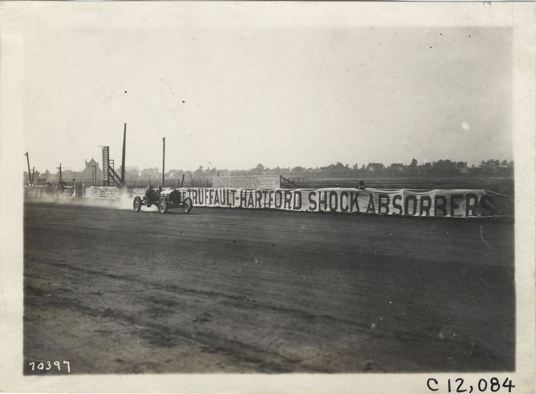 Driver and passenger in racecar, 1911 Brighton Beach races