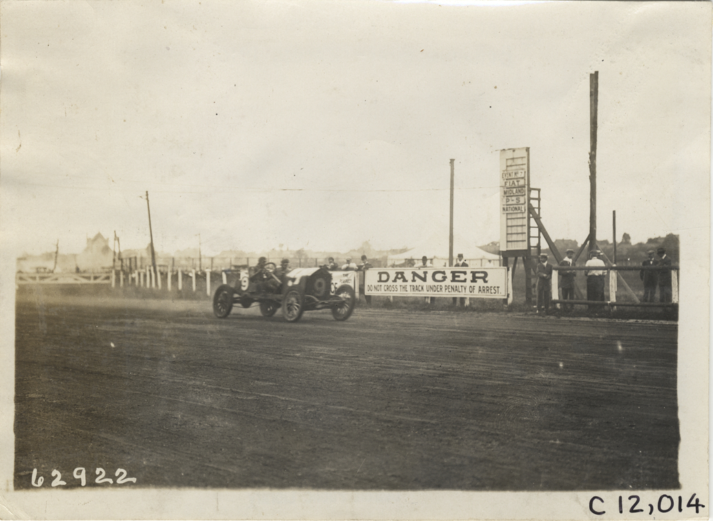Driver and passenger in racecar, 1910 Brighton Beach races