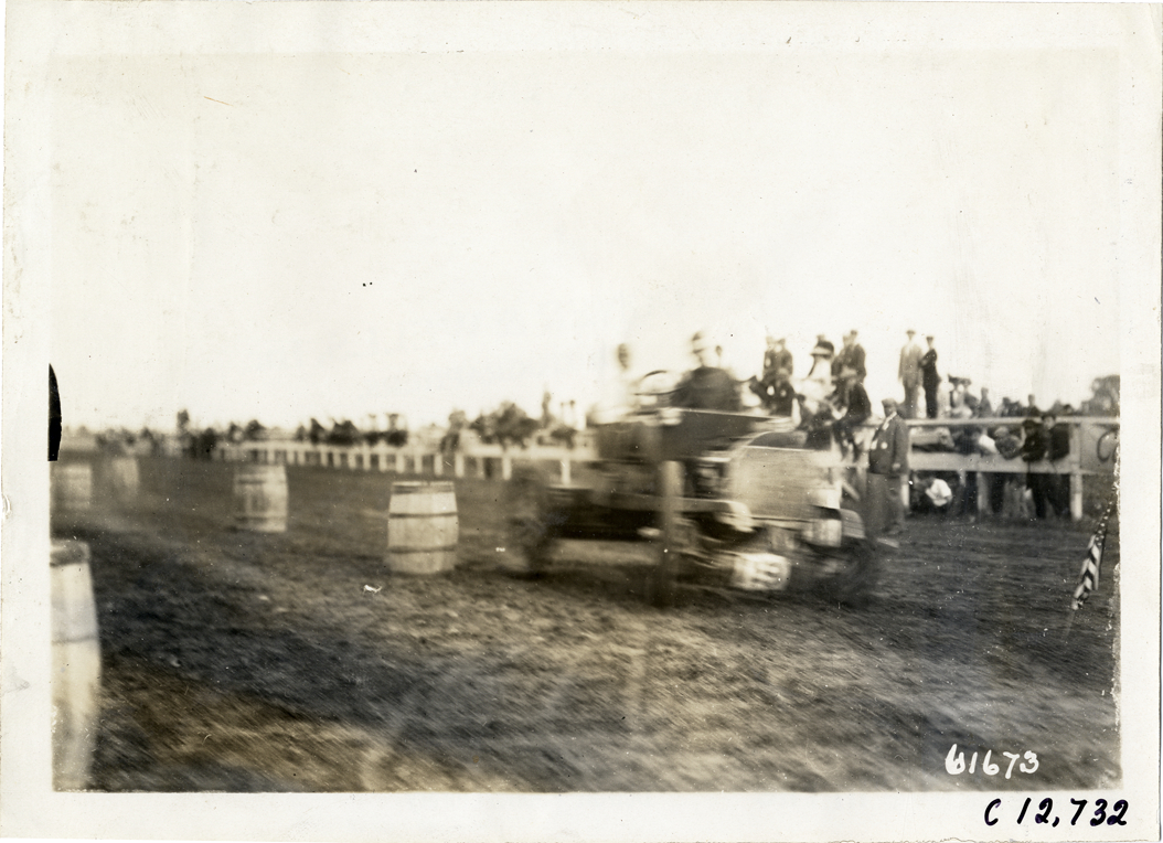 Racecar driving through obstacle course, 1910 Empire City races