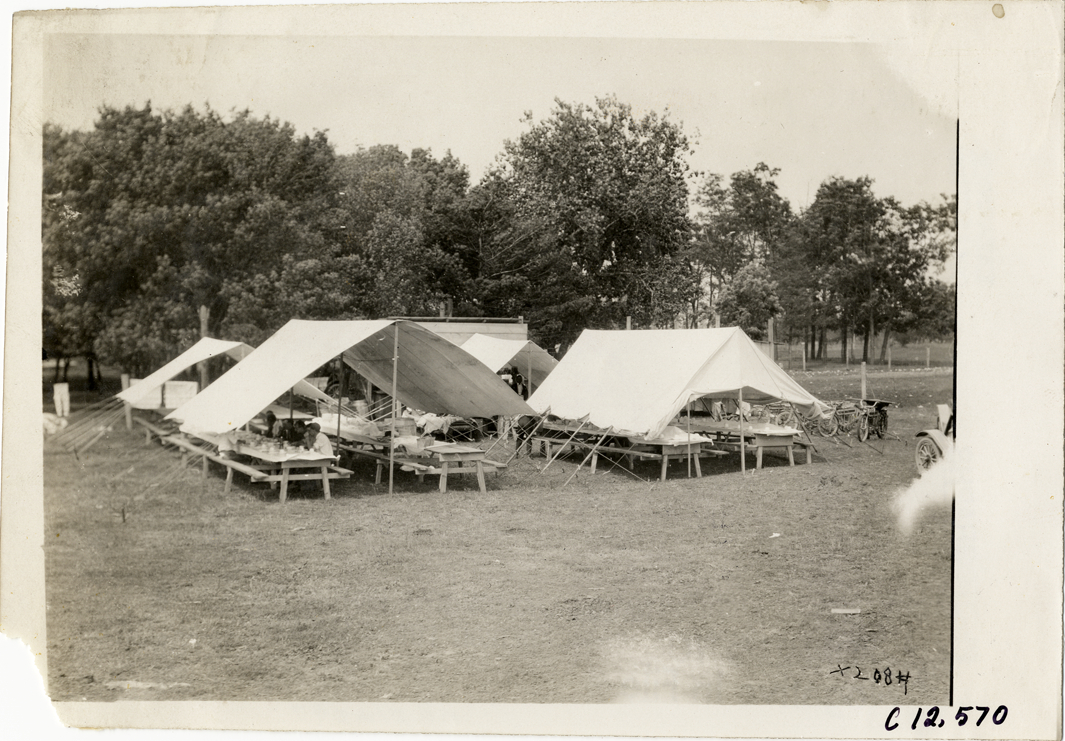 Picnic tables under tents, 1910 Elgin Races