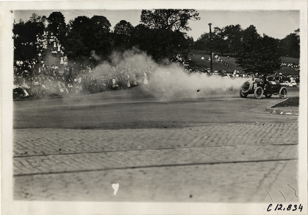 Driver and passenger in racecar, 1909 Fairmount Park races