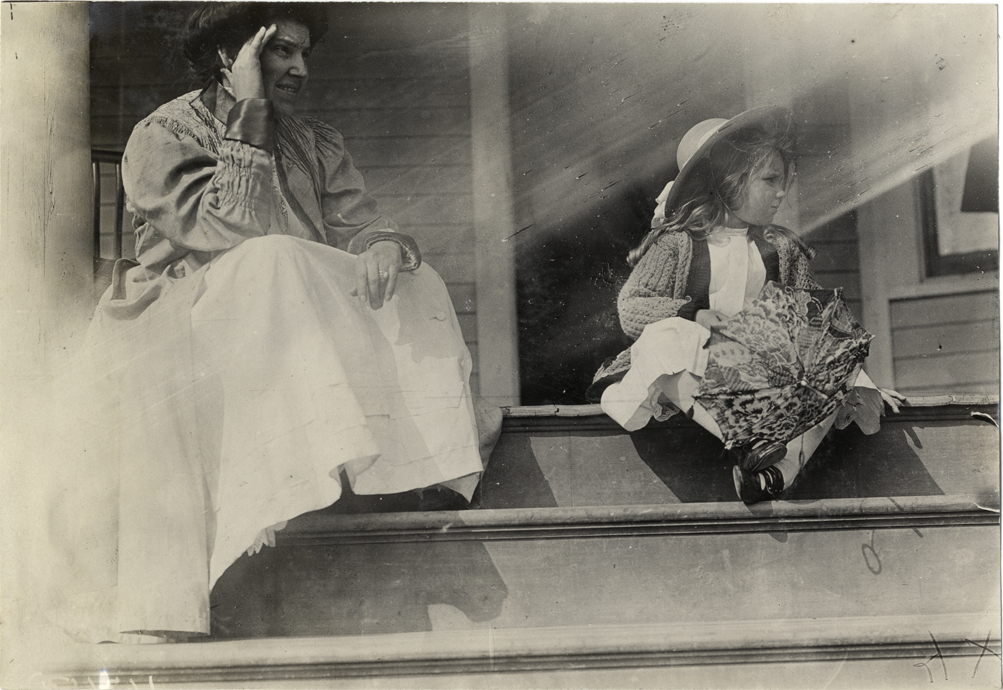 Marion Spooner and woman on porch, 1908 Grand Prize races