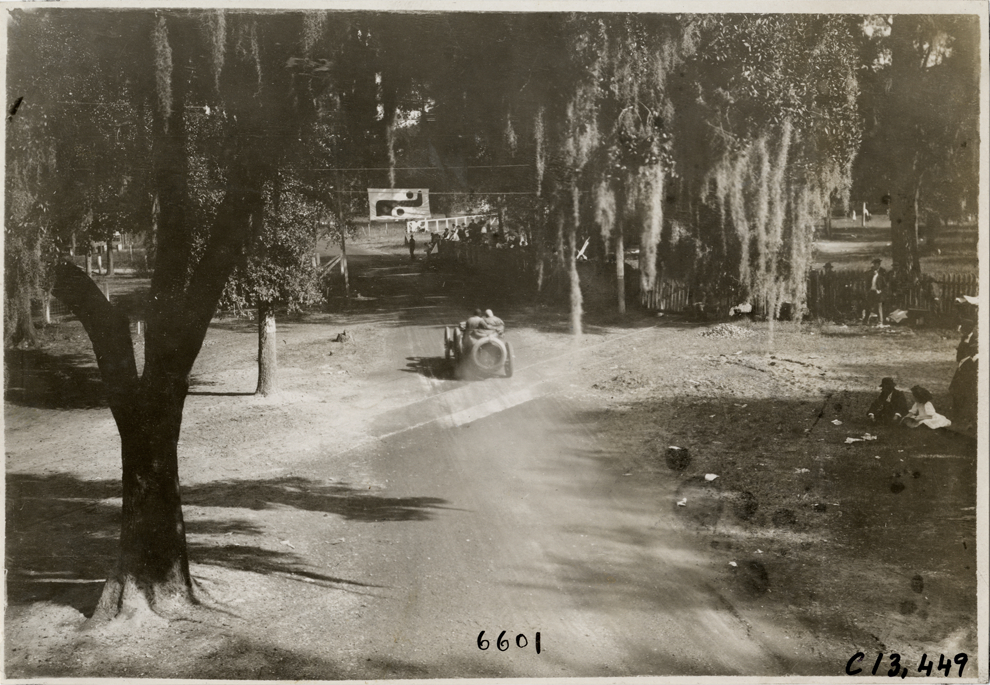 Driver and passenger in racecar, 1908 Grand Prize races