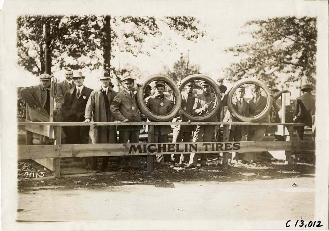 Men posing with Michelin tires, 1911 Fairmount Park races