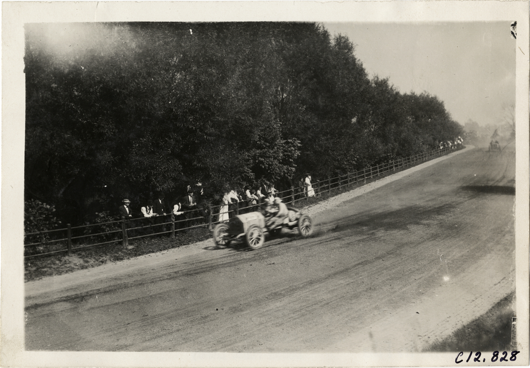 Driver and passenger in racecar, 1909 Fairmount Park races