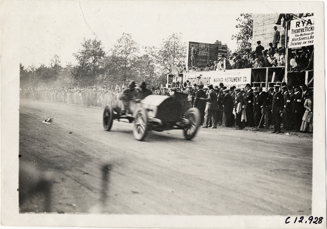 Driver and passenger in racecar, 1909 Fairmount Park races