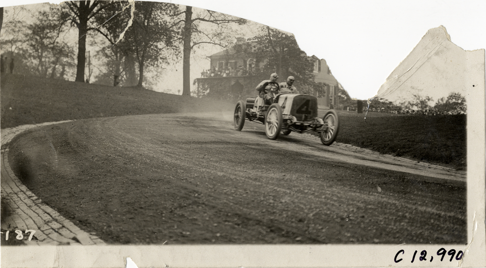 Driver and passenger in racecar, 1910 Fairmount Park races